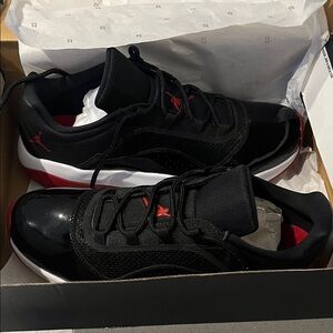 Jordan 11 Retro Low Black and Red Sneakers